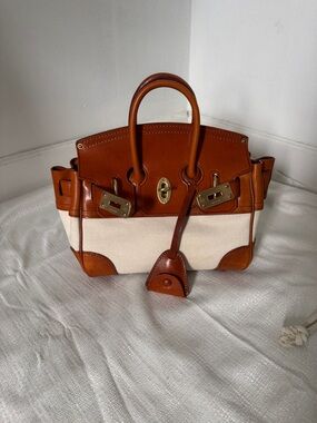 Vintage-inspired Atorie mini bag in rich caramel leather